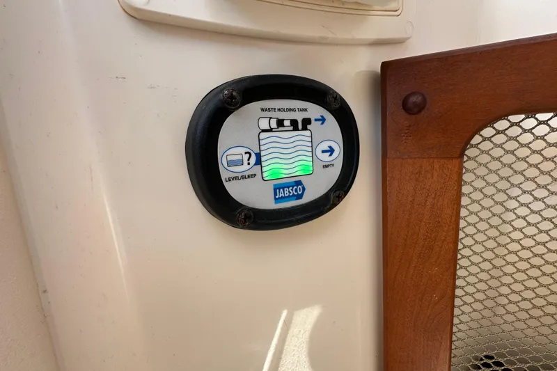 Slide: The Image of 2016 Grady-White Freedom 275 boat interior with open windshield and seating. - 82