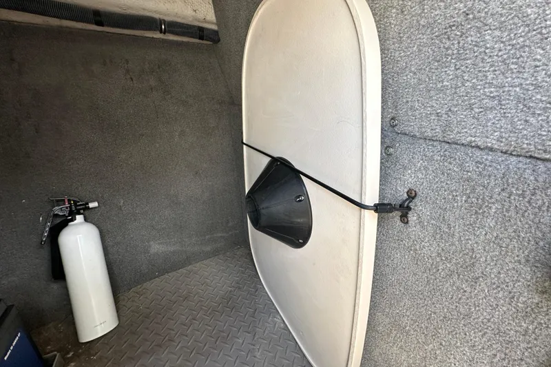 Slide: The Image of 2016 Grady-White Freedom 275 boat interior with beige seating and logo detail. - 90