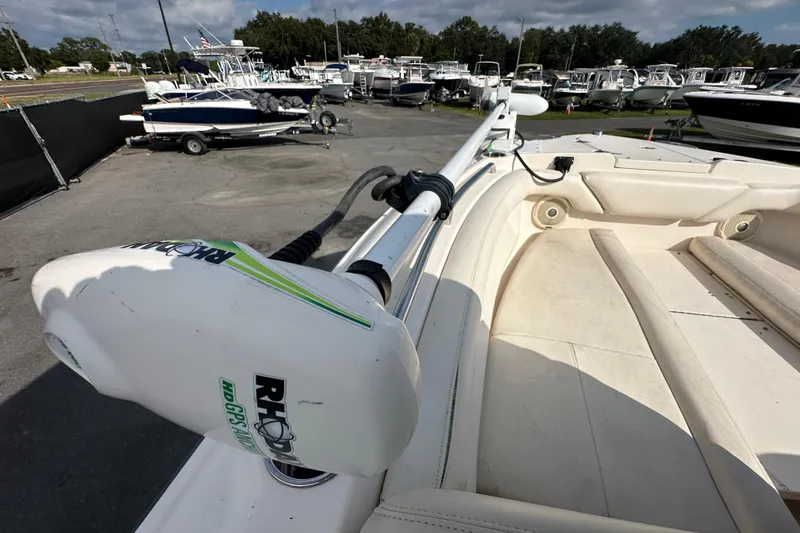 Slide: The Image of 2016 Grady-White Freedom 275 boat interior with cushioned seating and storage compartments. - 93