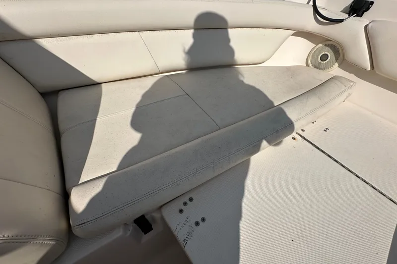 Slide: The Image of 2016 Grady-White Freedom 275 boat interior with seating and storage compartments. - 95