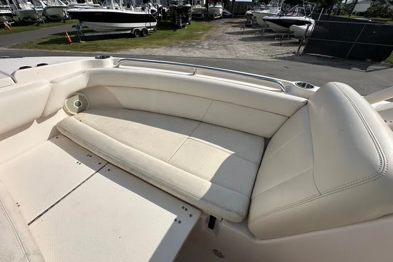 Slide: The Image of 2016 Grady-White Freedom 275 boat interior with seating and storage compartments. - 97