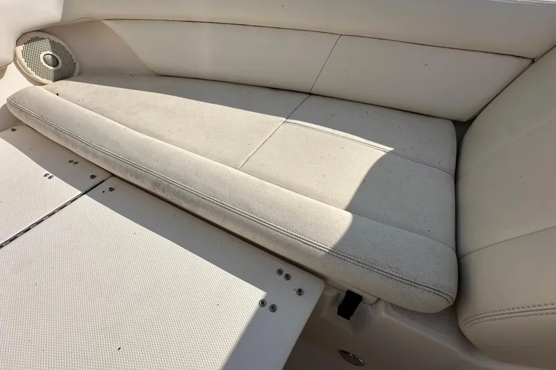 Slide: The Image of 2016 Grady-White Freedom 275 boat interior with seating and storage compartments. - 98