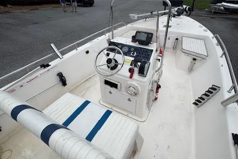 Slide: The Image of 2002 Seafox 195 Bay Fisher boat interior with steering console and seating. - 12