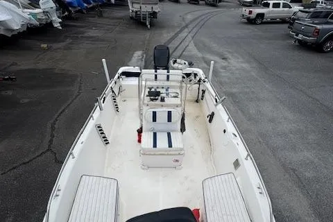 Slide: The Image of 2002 Seafox 195 Bay Fisher boat, white interior, docked in a marina. - 7