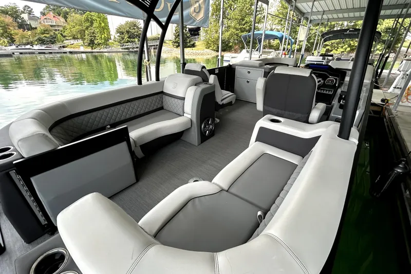Slide: The Image of Luxurious seating on 2025 Godfrey AquaPatio 255 SDC Slide boat interior. - 13