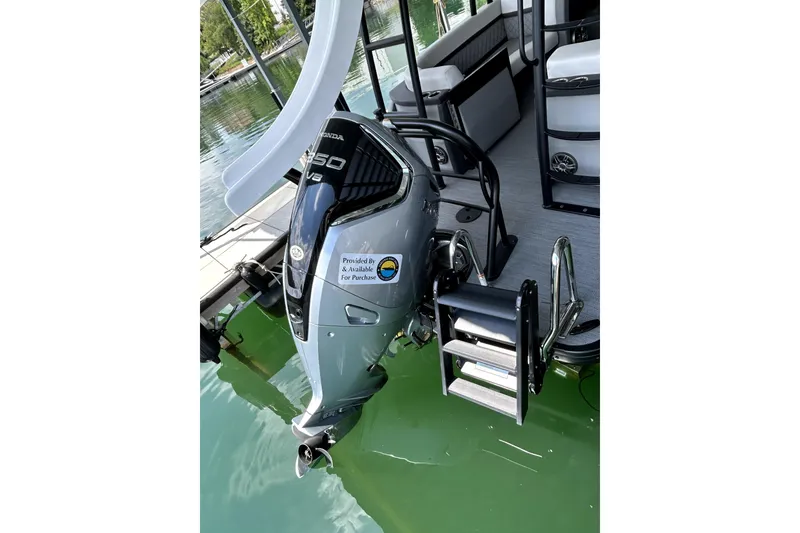 Slide: The Image of 2025 Godfrey AquaPatio 255 SDC Slide pontoon boat with slide and Honda outboard motor. - 15