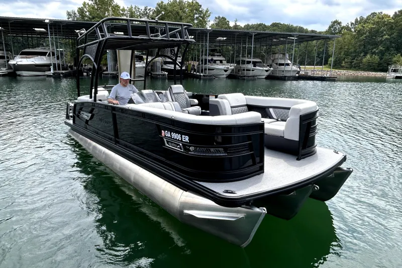 Slide: The Image of 2025 Godfrey AquaPatio 255 SDC Slide boat interior with modern steering and seating. - 17