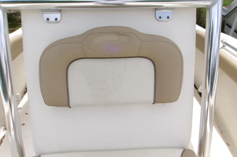 Slide: The Image of 2020 Key West 219 FS boat seat with beige cushion and metal frame. - 11