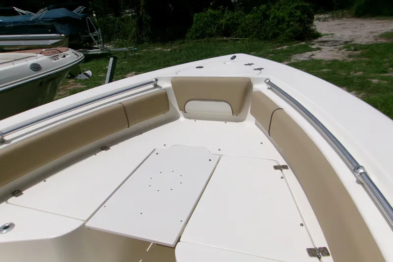 Slide: The Image of 2020 Key West 219 FS boat interior with beige seating and stainless steel rails. - 16