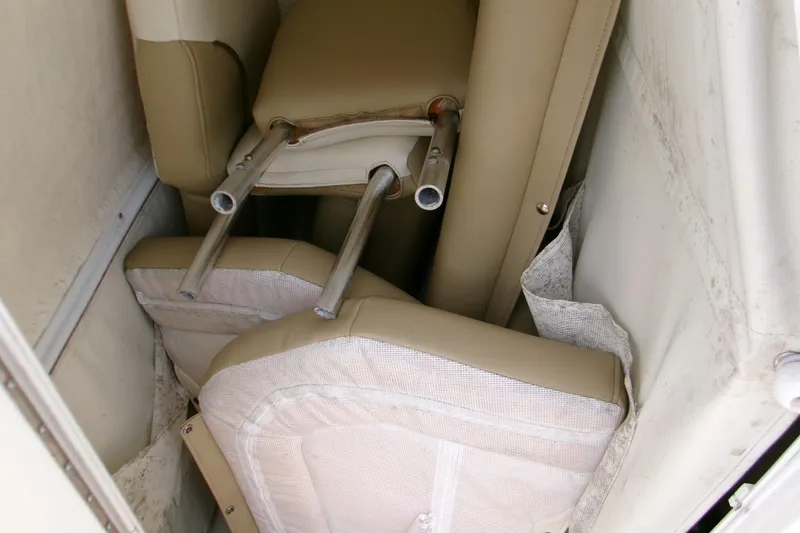 Slide: The Image of Stored boat cushions and seat parts inside a Key West 219 FS, 2020 model. - 4