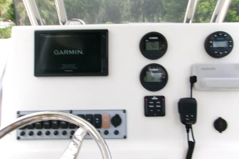 Slide: The Image of 2020 Key West 219 FS boat dashboard with Garmin navigation system and controls. - 8