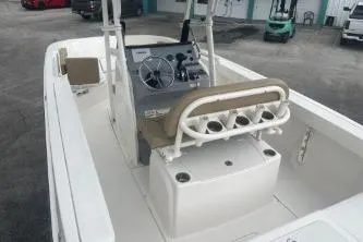 Slide: The Image of 2023 Bayliner Trophy T22CC boat interior with steering console and seating. - 5