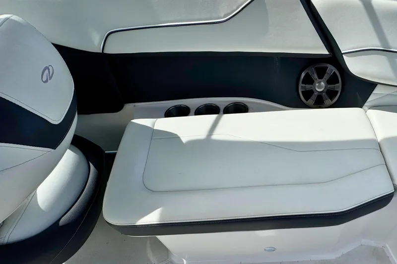 Slide: The Image of Interior seating of 2022 Regal 23 OBX boat with cup holders and speaker. - 10