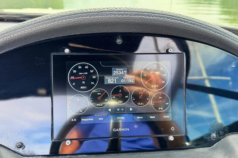 Slide: The Image of Garmin display on 2022 Regal 23 OBX boat dashboard showing engine metrics. - 14