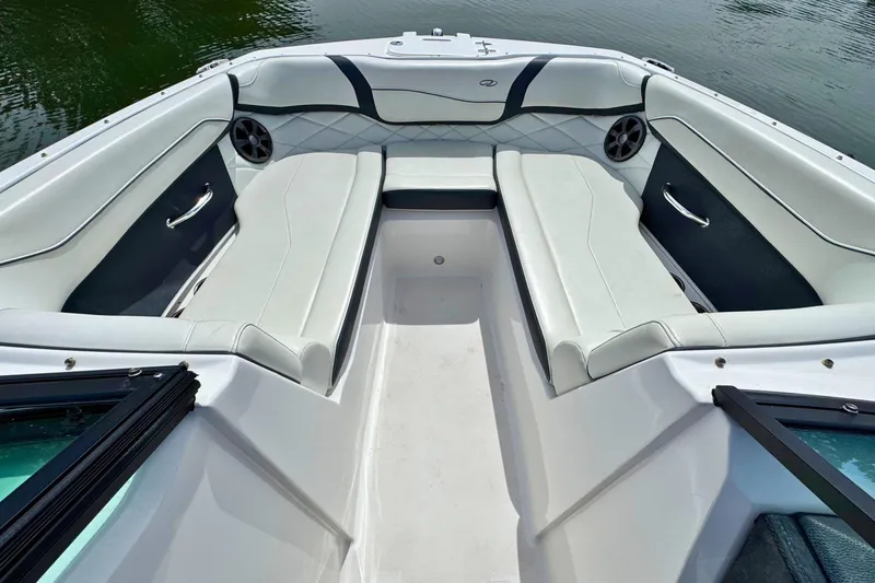 Slide: The Image of 2022 Regal 23 OBX boat interior with white seating and sleek design. - 18