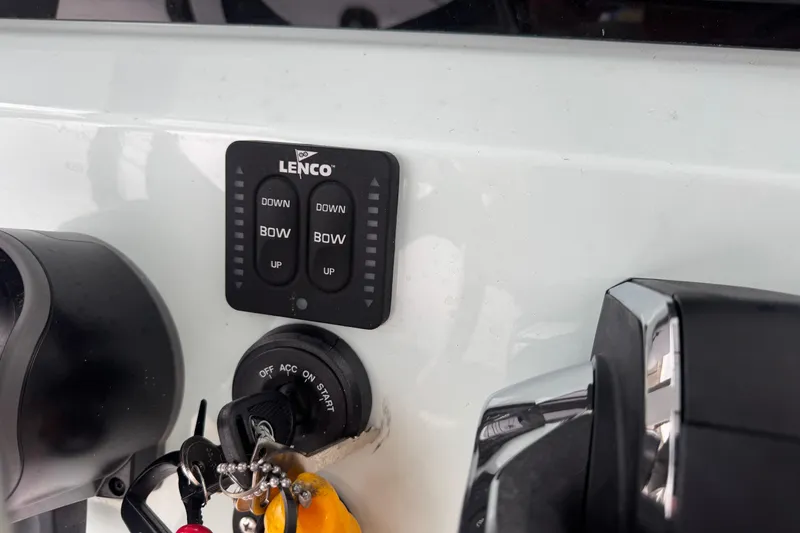 Slide: The Image of Control panel of 2026 Blazer Bay 2440 boat with Lenco trim tab switches. - 11
