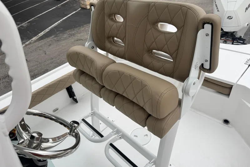 Slide: The Image of 2026 Blazer Bay 2440 boat seat with tan diamond-stitched upholstery and steering wheel. - 20