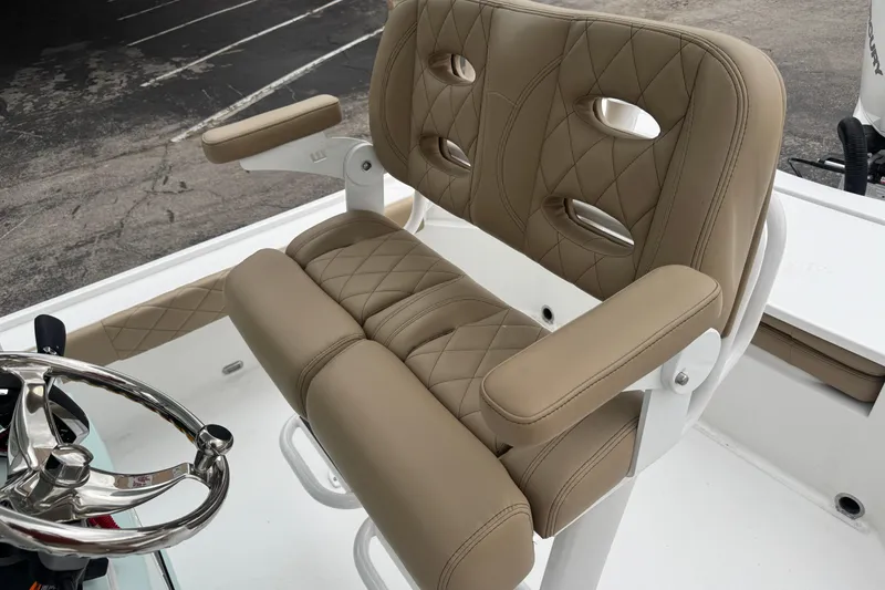 Slide: The Image of 2026 Blazer Bay 2440 boat seat with tan quilted upholstery and chrome steering wheel. - 21