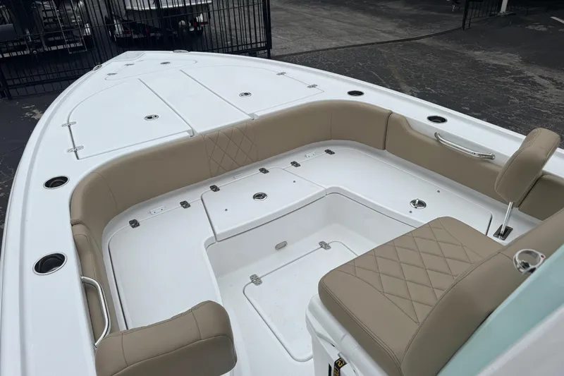 Slide: The Image of 2026 Blazer Bay 2440 boat interior with beige seating and storage compartments. - 31