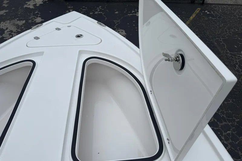 Slide: The Image of 2026 Blazer Bay 2440 boat storage compartments with open hatch on deck. - 39