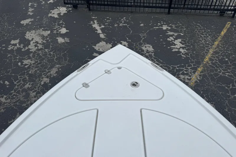 Slide: The Image of Bow of 2026 Blazer Bay 2440 boat on cracked asphalt surface. - 40