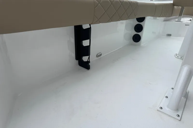 Slide: The Image of 2026 Blazer Bay 2440 boat interior with beige seating and white deck. - 44