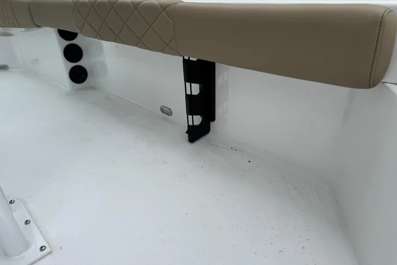 Slide: The Image of 2026 Blazer Bay 2440 boat interior with cushioned seating and rod holders. - 45