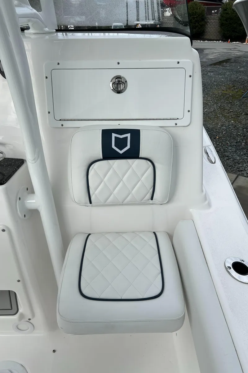 Slide: The Image of 2024 Sea Fox 248 Side Console boat seat with quilted white upholstery. - 14