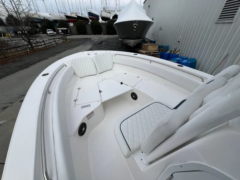 Slide: The Image of 2024 Sea Fox 248 Side Console boat with white seating and spacious deck. - 5