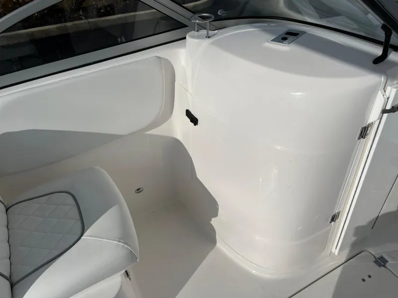 Slide: The Image of Interior of 2024 Sea Fox 228 Traveler boat with white seating and storage compartment. - 22