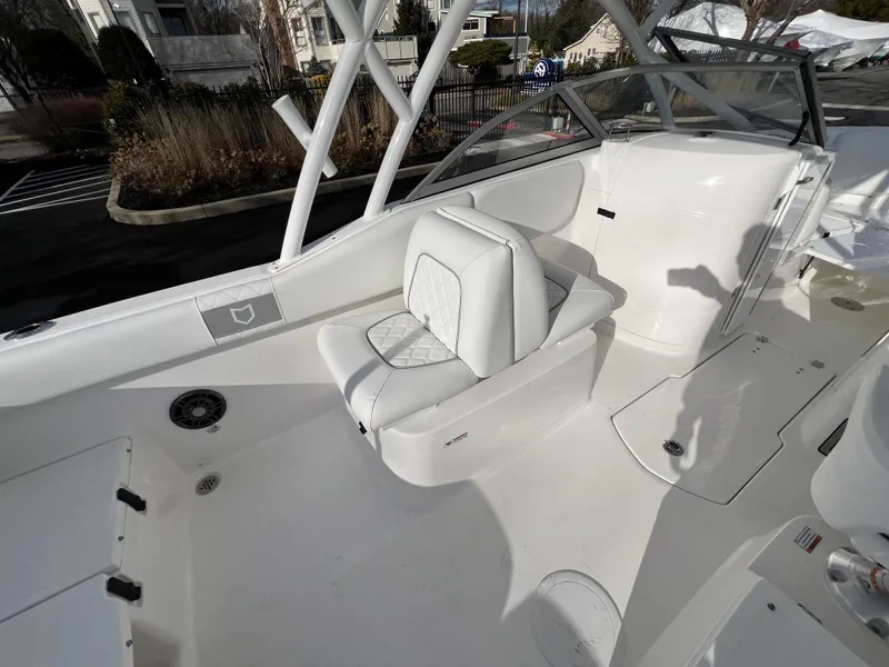Slide: The Image of 2024 Sea Fox 228 Traveler boat interior with white seating and console. - 25