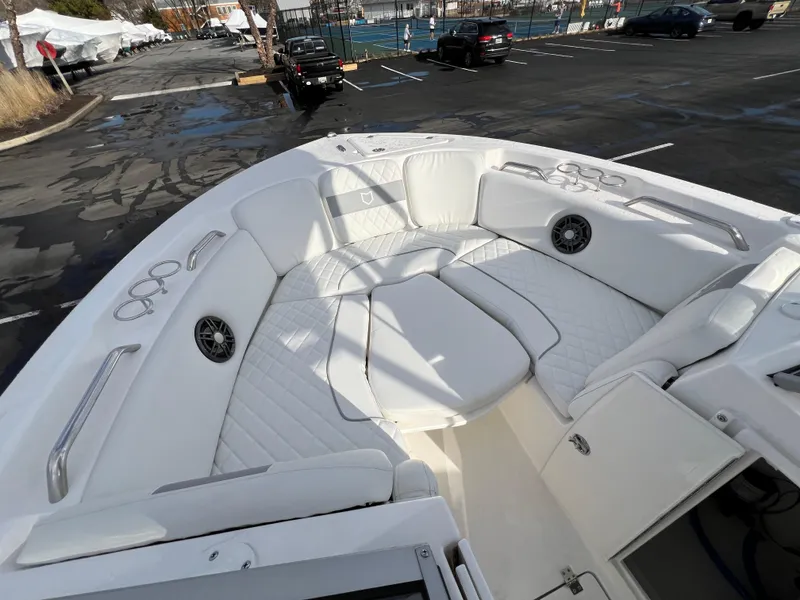 Slide: The Image of 2024 Sea Fox 228 Traveler boat with spacious white seating and cup holders. - 28