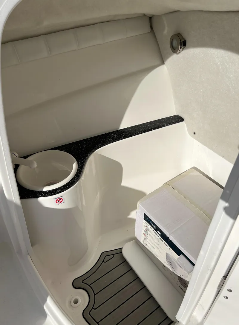 Slide: The Image of 2024 Sea Fox 228 Traveler boat interior with storage and sink. - 32