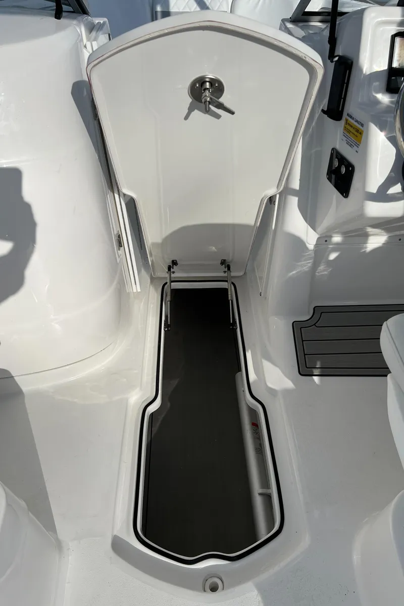 Slide: The Image of 2024 Sea Fox 228 Traveler boat storage compartment with open hatch. - 33