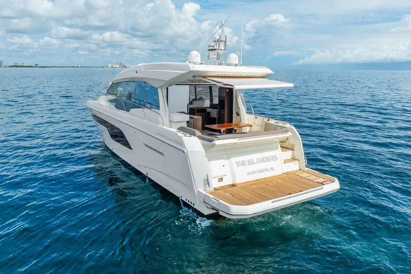 Slide: The Image of Luxury 2018 Prestige 520S yacht cruising on open sea under blue sky. - 13