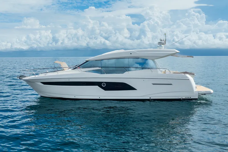 Slide: The Image of 2018 Prestige 520S yacht cruising on open sea under cloudy sky. - 15