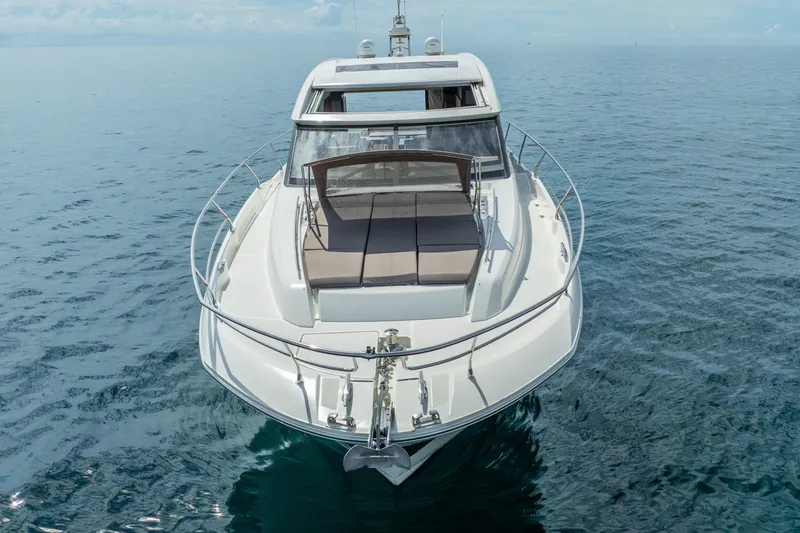 Slide: The Image of 2018 Prestige 520S yacht on calm ocean waters, front view. - 17