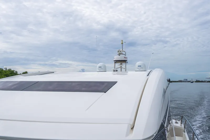 Slide: The Image of 2018 Prestige 520S yacht cruising on calm waters under a cloudy sky. - 22
