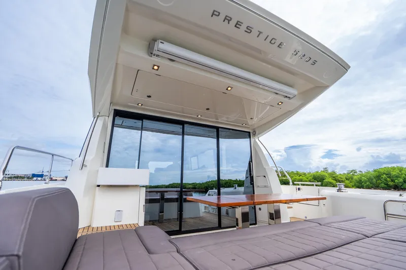 Slide: The Image of Luxury 2018 Prestige 520S yacht with spacious outdoor seating and sleek design. - 28