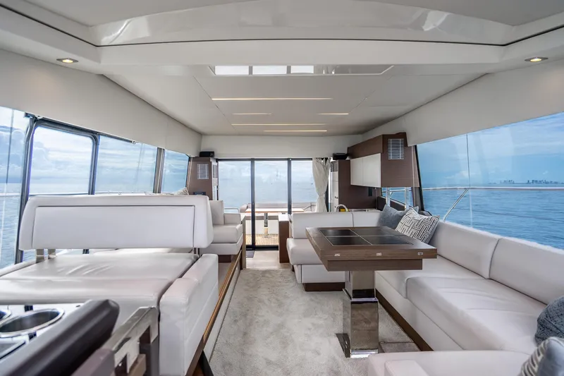 Slide: The Image of Luxurious interior of 2018 Prestige 520S yacht with modern seating and ocean view. - 34