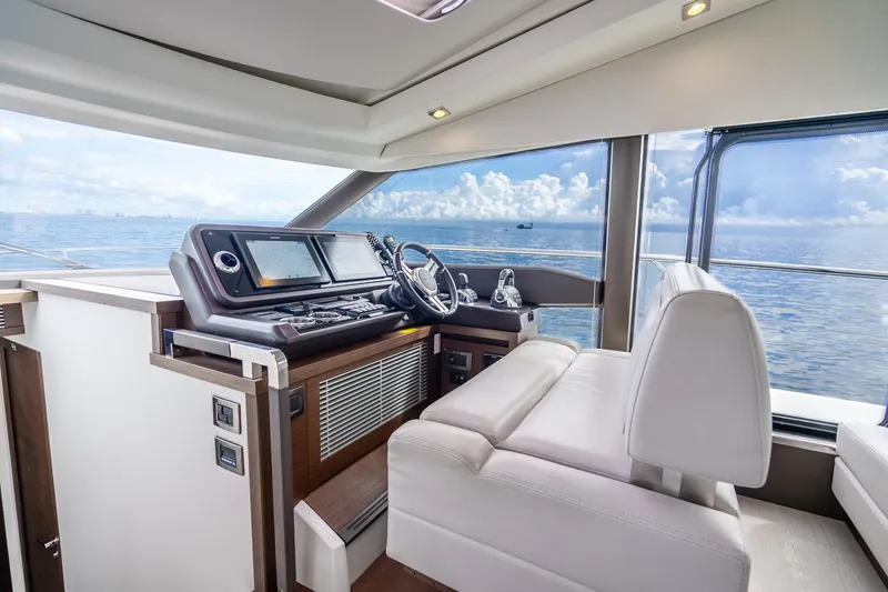 Slide: The Image of Interior of 2018 Prestige 520S yacht with modern helm and ocean view. - 43