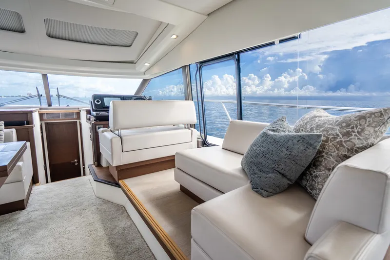 Slide: The Image of Luxurious interior of 2018 Prestige 520S yacht with ocean view and plush seating. - 44