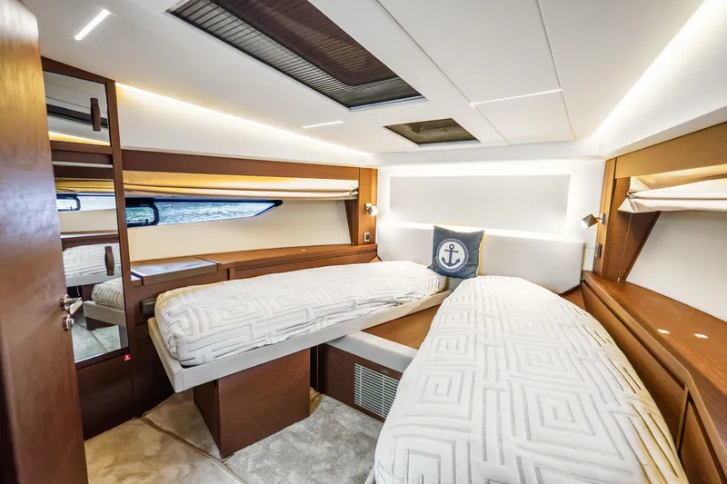 Slide: The Image of Luxurious cabin interior of 2018 Prestige 520S yacht with twin beds and nautical decor. - 54