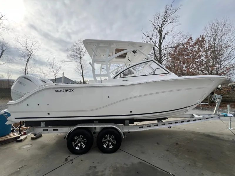 The Image of 2024 Sea Fox 268 Traveler boat on trailer, side view, outdoors. - 0