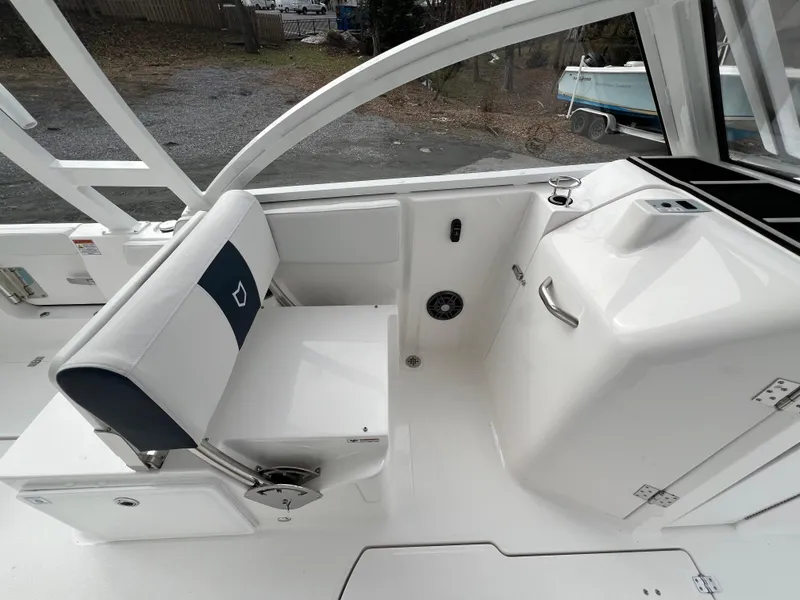 Slide: The Image of 2024 Sea Fox 268 Traveler boat interior with seating and storage. - 10