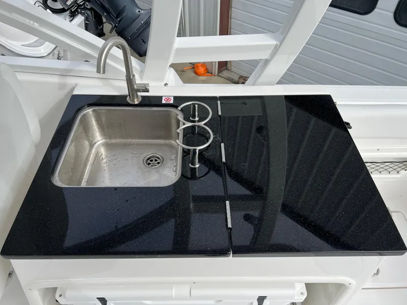 Slide: The Image of 2024 Sea Fox 268 Traveler boat sink with black countertop. - 16