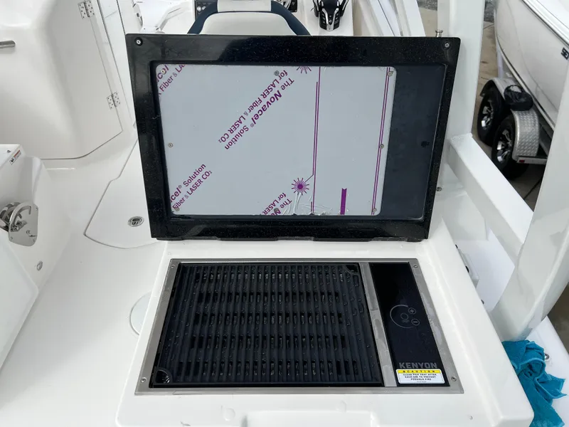 Slide: The Image of 2024 Sea Fox 268 Traveler boat grill and storage compartment. - 17