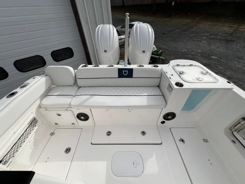 Slide: The Image of 2024 Sea Fox 268 Traveler boat interior with seating and dual engines. - 20