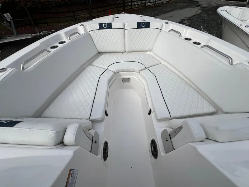 Slide: The Image of 2024 Sea Fox 268 Traveler boat interior with white cushioned seating. - 7