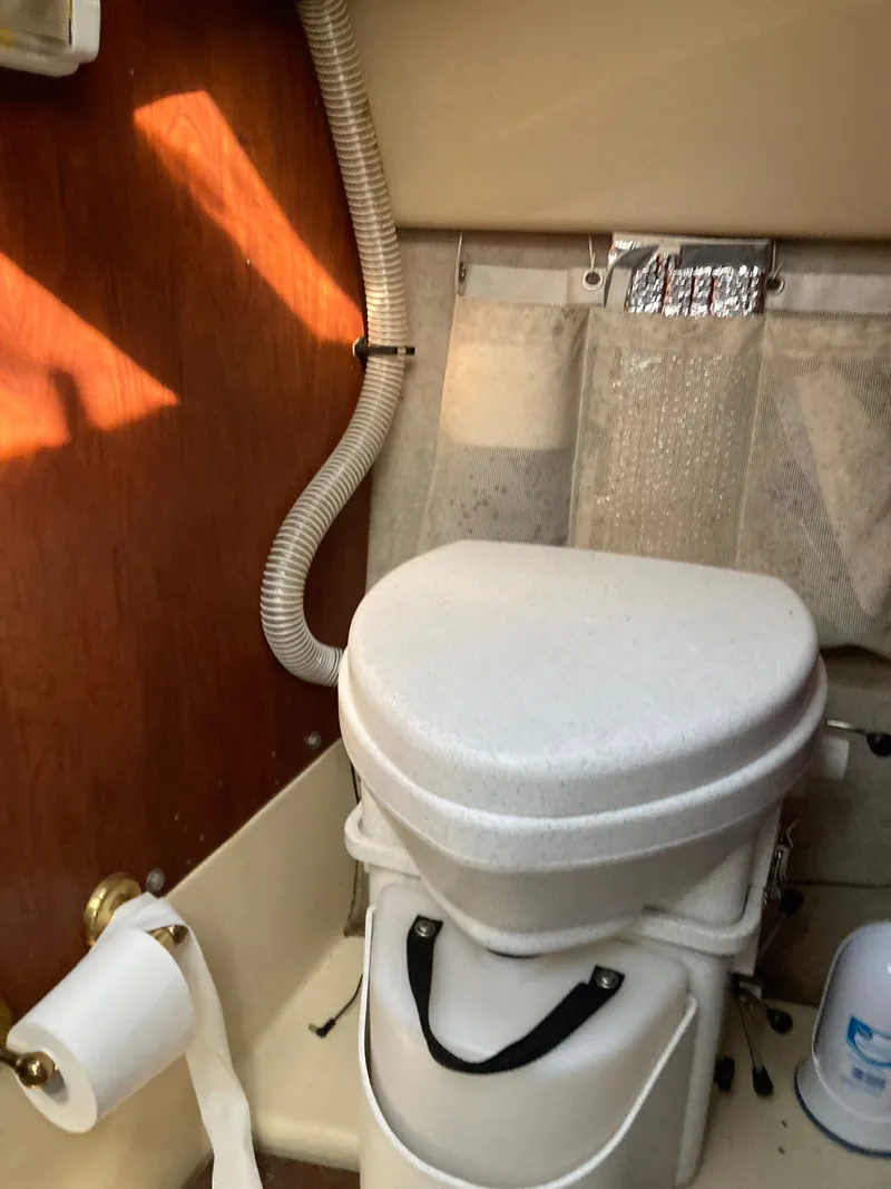 Slide: The Image of Interior of a 2007 MacGregor 26 yacht with toilet. - 14